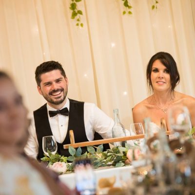 Couple laughing during speeches at Avalon Castle