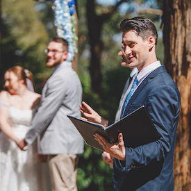 Adam Jackson performing wedding ceremony at Avalon Castle wedding venue